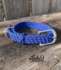 Blue braided dog collar with silver buckle on a wooden surface, featuring 'Lucky U Custom Designs' logo.