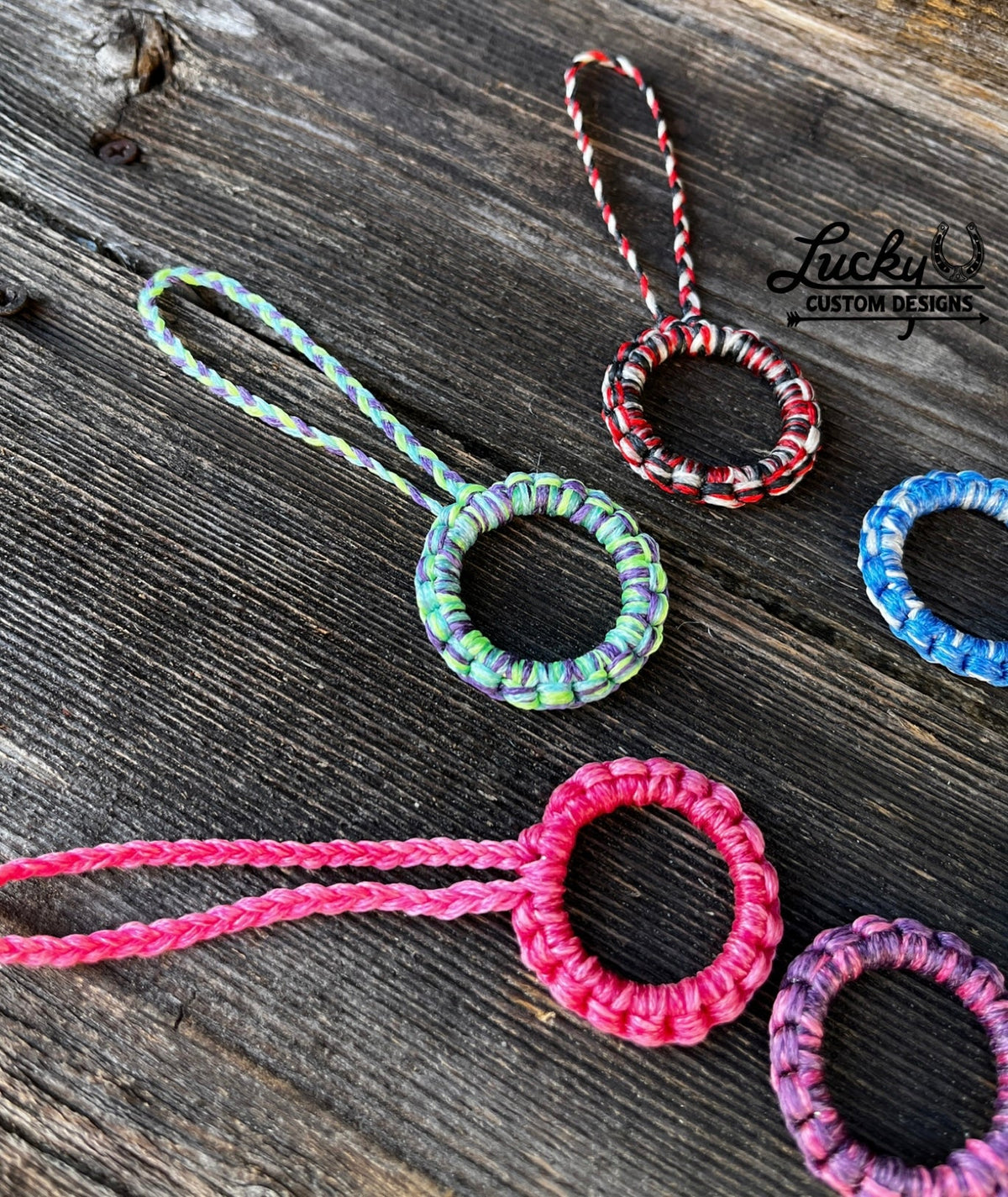 Sinew keychains made with various color combinations.