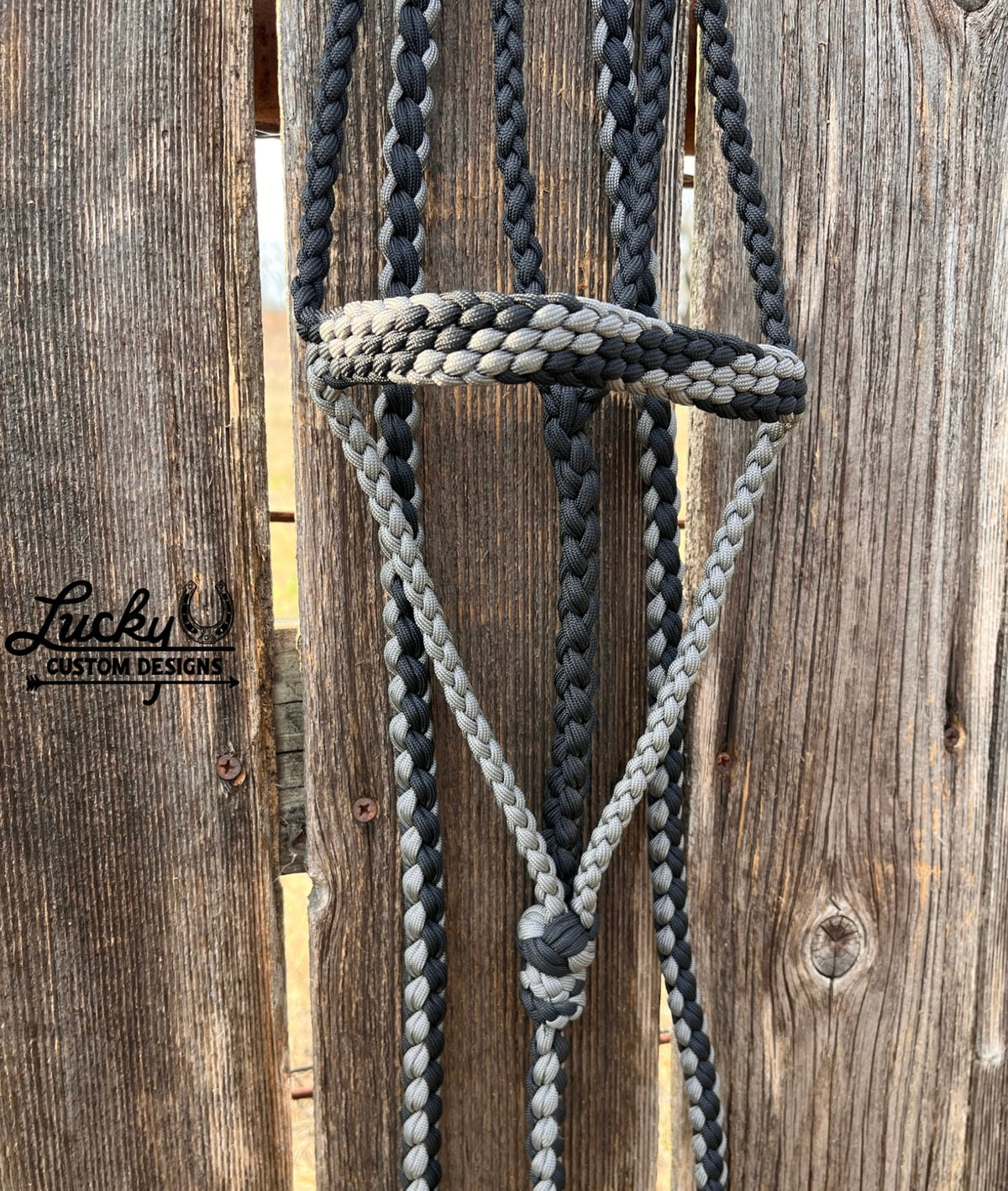 The paracord halter is built for cowboys & cowboy-gals who value quality & durability. 
Every halter is created from a continuous length of paracord. The cord is cut from the spool & never cut again during the braiding phase, resulting in a cleaner, stronger, & more dependable design. Each braid is extremely tight for strength and durability.
This is a one-of-a-kind design. 
