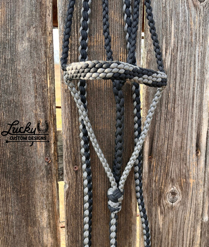 The paracord halter is built for cowboys & cowboy-gals who value quality & durability. 
Every halter is created from a continuous length of paracord. The cord is cut from the spool & never cut again during the braiding phase, resulting in a cleaner, stronger, & more dependable design. Each braid is extremely tight for strength and durability.
This is a one-of-a-kind design. 
