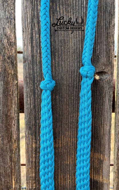 Each set of reins are handcrafted from eight strands of premium 550 paracord, creating a strong yet comfortable rein that feels great in your hands. The flat braided design helps prevent twisting, allowing the reins to lay naturally and provide consistent contact while riding.
Equipped with durable 1" Conway buckles, these reins are fully adjustable!