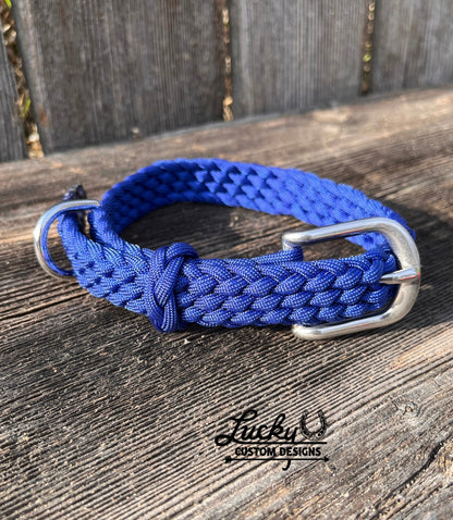 Each collar is handcrafted from four strands of premium 550 paracord, creating a strong and dependable collar built to withstand daily use. A durable buckle provides a secure fit, while the integrated D-ring makes it easy to attach a leash.&nbsp;
Designed with versatility in mind, these collars are adjustable to fit dogs of all sizes.

Small Collars are 20” long &amp; 3/4” thick