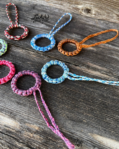 Sinew keychains made with various color combinations.