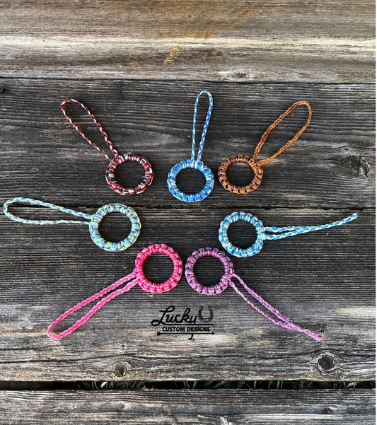 Sinew keychains made with various color combinations.