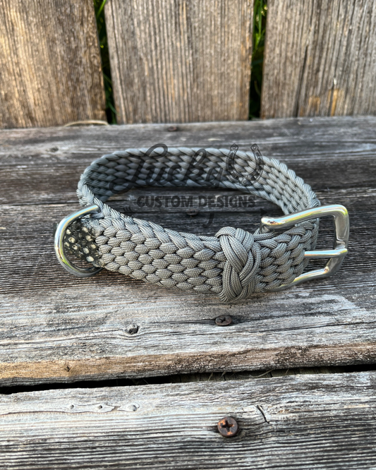 Each collar is handcrafted from six strands of premium 550 paracord, creating a strong and dependable collar built to withstand daily use. A durable buckle provides a secure fit, while the integrated D-ring makes it easy to attach a leash.&nbsp;
Designed with versatility in mind, these collars are adjustable to fit dogs of all sizes.

Large collars are 26” long &amp; 1 1/4” thick.&nbsp;