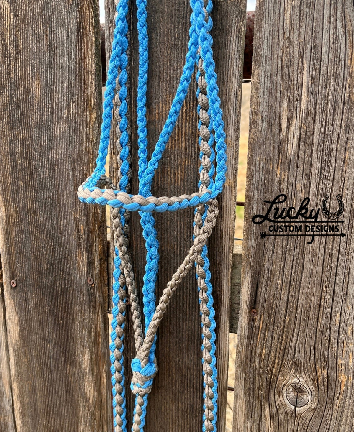 The paracord halter is built for cowboys & cowboy-gals who value quality & durability. 
Every halter is created from a continuous length of paracord. The cord is cut from the spool & never cut again during the braiding phase, resulting in a cleaner, stronger, & more dependable design. Each braid is extremely tight for strength and durability.
This is a one-of-a-kind design. 