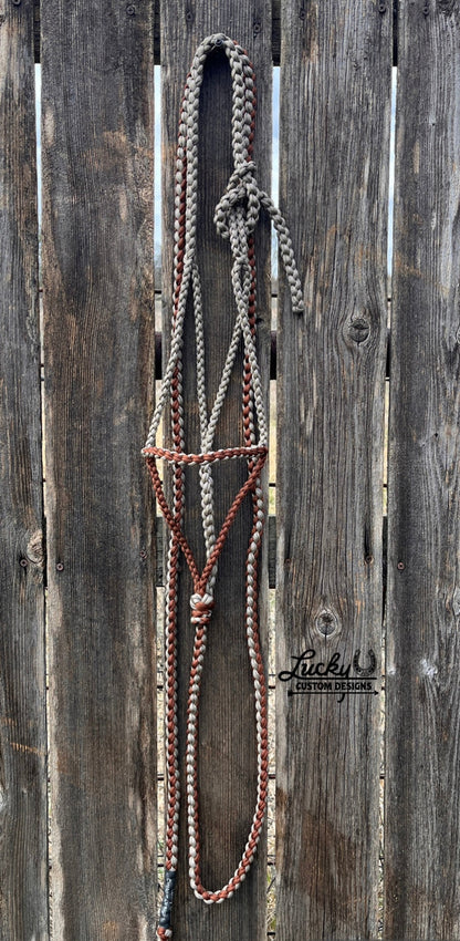 The paracord halter is built for cowboys & cowboy-gals who value quality & durability. 
Every halter is created from a continuous length of paracord. The cord is cut from the spool & never cut again during the braiding phase, resulting in a cleaner, stronger, & more dependable design. Each braid is extremely tight for strength and durability.
This is a one-of-a-kind design. 
