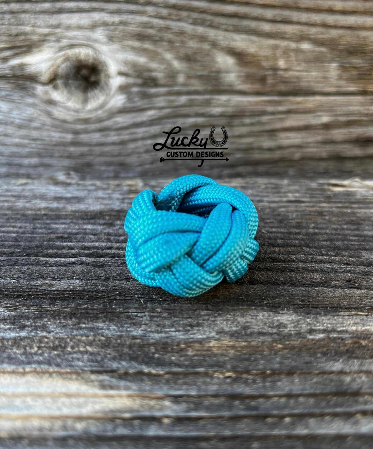Simple wild rag slides out of one strand of paracord that's smooth on the inside and will keep your rag snug